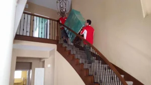Attention to Detail Movers Carrying a Matress to an Upstairs Apartment
