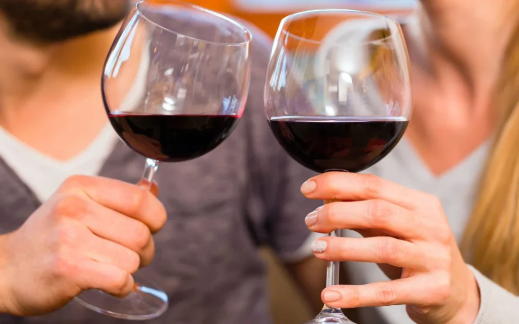 Attention to Detail Moving How to Pack Wine Glasses for your Move - Couple Cheering their Wine Glasses