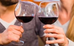 Attention to Detail Moving How to Pack Wine Glasses for your Move - Couple Cheering their Wine Glasses