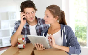 Couple Asking Moving Company Questions Before Hiring a Moving Company