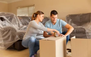 Couple Packing and Labeling Moving Boxes